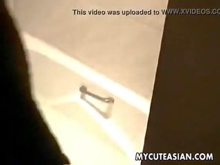 Charming Asian teen uses her huge blue dildo to fuck her wet punani
